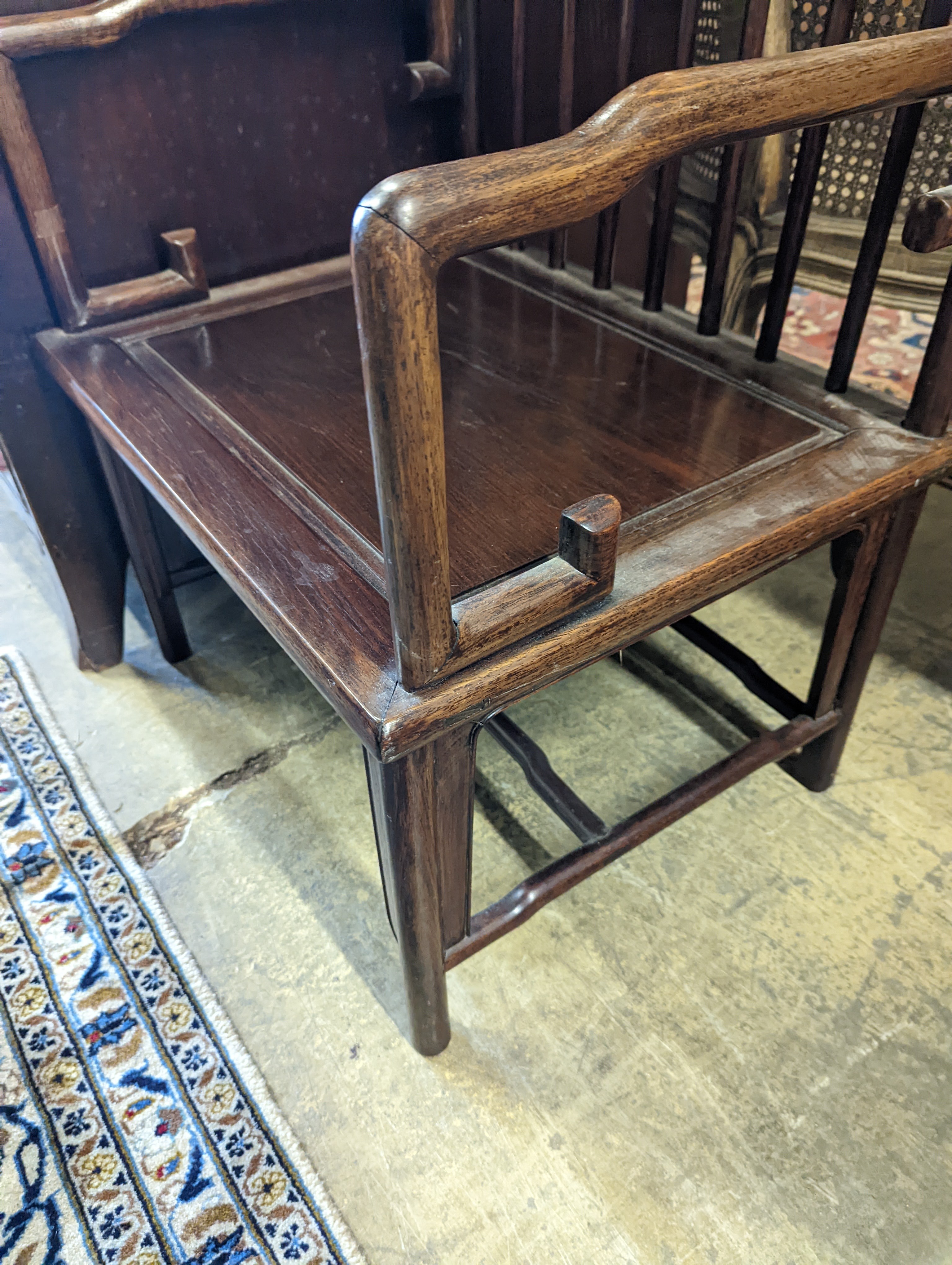 A pair of mid 20th century Chinese Hongmu elbow chairs with cushion seats, width 58cm, depth 49cm, height 92cm